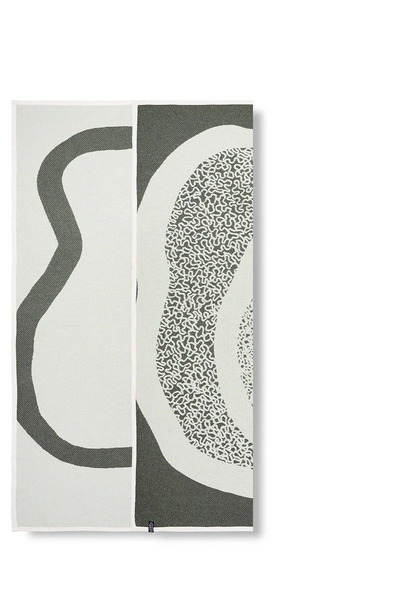 Cotton Blanket “Merging Islands” in Tea Green by Roland Schär