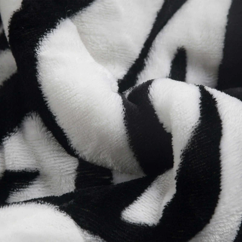Couette réversible tempérée, blanche et noire - Collection Safari